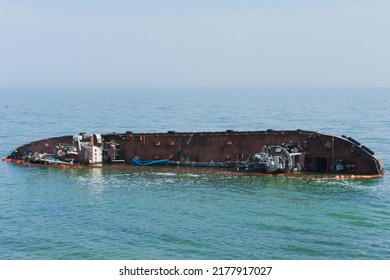 Sunken Abandoned Ship In Water. Ship Wreck, Storm, Tragedy. Destroyed. Metal. Rusty. Shore. Cargo. Sink. Sinking. Corrosion. Rust-eaten. Seascape. Storm. Industrial. Sailing. Damaged