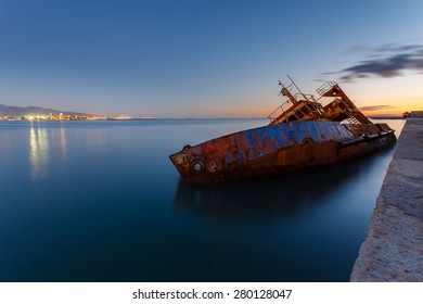 Sunken Fishing Ship Below Water, Abandoned In The Dock Near Piraeus In Greece