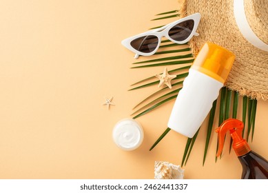 Sun-kissed essentials on a pastel orange canvas: top view of SPF bottles, straw hat, shades, seashell, starfish, and palm leaf. Protect your skin in style. Ad space awaits - Powered by Shutterstock