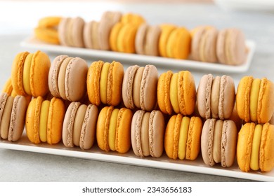 Sun-kissed yellow macarons radiate with tropical allure, showcasing the finesse of French patisserie. Each piece, a harmonious blend of crisp exterior and luscious interior