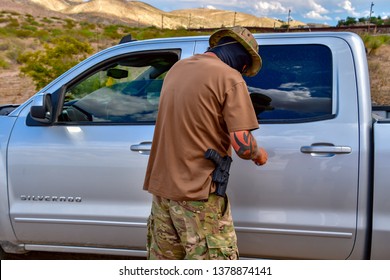 Sunland Park, New Mexico  USA-23 April 2019: A Militia Member Trying To Block Migrants From Entering The US Carries A Handgun In Visible Holster.
