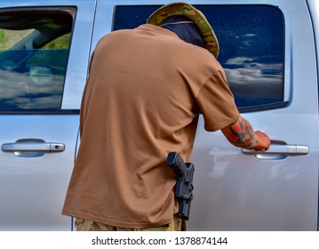 Sunland Park, New Mexico  USA-23 April 2019: Angry Armed Militia  Member Trying To Block Migrants From Entering The US Carries A Handgun In Visible Holster.