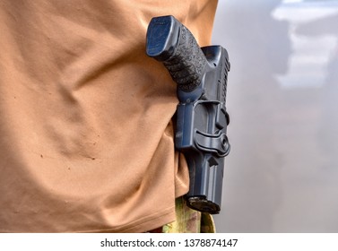 Sunland Park, New Mexico  USA-23 April 2019: A Militia Member Trying To Block Migrants From Entering The US Carries A Handgun In Visible Holster.
