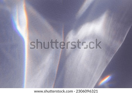 Sunlight background, abstract backdrop with light and shadow, glare and shine on paper texture, rainbow sun flare, blue violet color aesthetic image. Natural beams light, caustics effect, top view