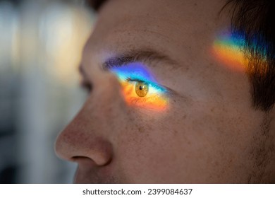 Sunlight beam falling on temple, eye, refracting through lens, creating magic optical rainbow effect. Colorful solar spectrum dispersion. Beautiful physical phenomenon. Can be used as LGBT symbol