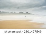 Sunlight Begins To Brighten Day On Cannon Beach in Oregon