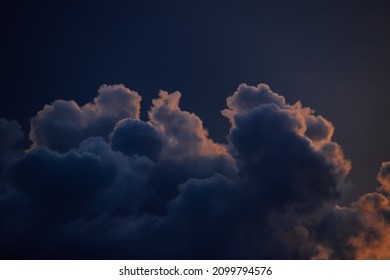 Sunlight behind strong clouds. 
Interesting shapes of Dramatic Cloudscape.