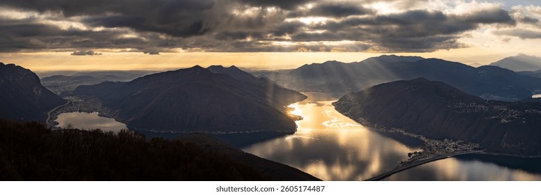 Sunlight Breaking Through Clouds Over Alpine Lake