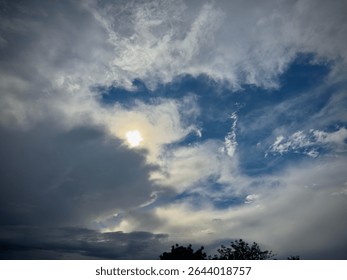 Sunlight Breaking Through Storm Clouds – Hopeful Sky After the Rain