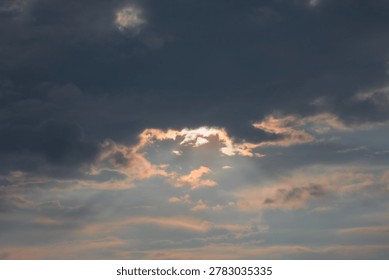 Sunlight Breaking Through Stormy Clouds