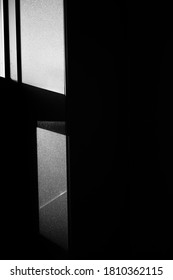 the sunlight coming into the window and the reflection on the wall