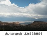 Sunlight coming through clouds over Anderson overlook and Sangre de Cristo, Loas Alamos, New Mexico