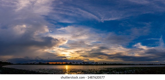 Sunlight with dramatic sky. sunset on dark background.Vivid orange cloud sky.