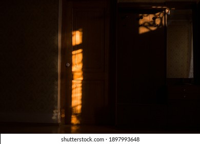  Sunlight falls through an empty room in an old,  home