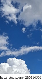 Sunlight filtering through thick clouds highlights the ever-changing beauty of the daytime sky.