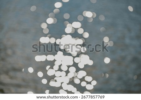 Sunlight glinting on the surface of calm water.