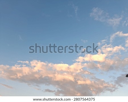 sunlight in the morning is complemented by reddish clouds