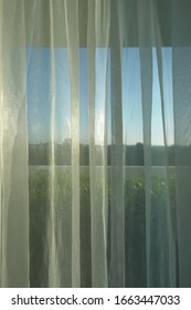 sunlight in morning day through white curtain on window