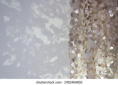 Sunlight On The Wall With Shadows From Of Fine Lace. Elegant Curtain, Vintage, Floral Pattern With Sequin. Ivory Color. White Abstract Space For Text.