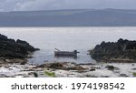 Sunlight over a Fishing boats and equipment at Greencastle Harbour Co Donegal 