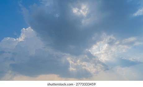 Sunlight peeking through the clouds; sunset.