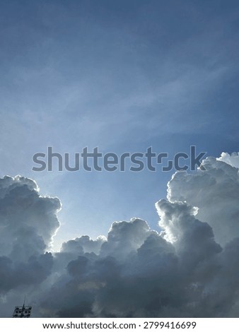 Sunlight piercing through the clouds at sunrise.