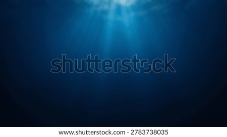 Sunlight rays penetrate deep blue ocean water, creating a serene and mysterious underwater background with a gradient from bright surface light to dark, tranquil depths.