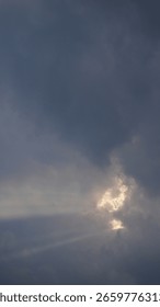 Sunlight Rays Piercing Through White Clouds - Atmospheric Sky
