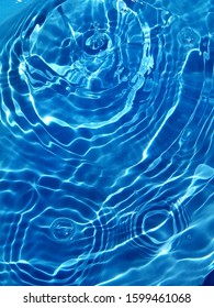 The sunlight reflected with surface waves of blue water in the deep sea