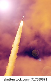 Sunlight and rocket. The elements of this image furnished by NASA.