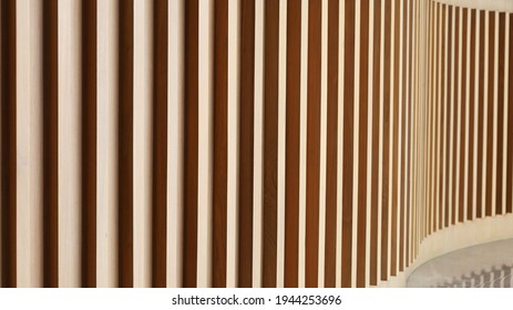 Sunlight and shadows on the surface of the wooden slats on the wall. Abstract wood background made by vertical incident light for background design with copy space. Selective focus - Powered by Shutterstock