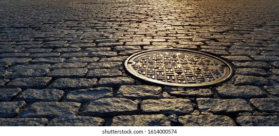 Sunlight shines on a manhole cover on a cobblestone street, Tribeca neighborhood of New York City NYC