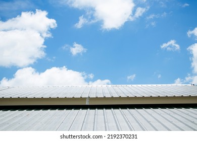 Sunlight Shines On White Metal Roof, Sky Background And Bright White Clouds.