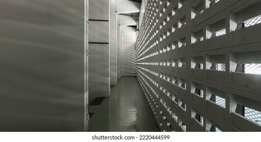 The Sunlight Shines Through Light Channels Wall Of Old Gymnasium. Concrete Walls Have Holes For Sunlight To Penetrate Through The Holes From The Outside, Light And Shadow, Panorama, Selective Focus.