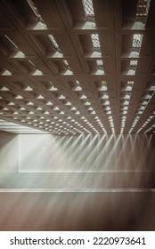 The Sunlight Shines Through Light Channels Wall Of Old Gymnasium. Concrete Walls Have Holes For Sunlight To Penetrate Through The Holes From The Outside, Light And Shadow Concept, Selective Focus.