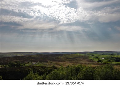sunlight shining through clouds