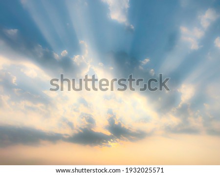 Sunlight shone on the clouds like a dragon spitting fire and on a blurred background.