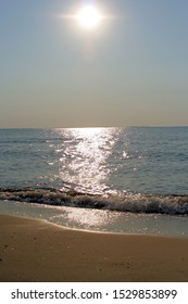 Sunlight Sparkles Off The Water At The Beach As The Wave Rolls In, Peaceful, Comforting, Thought Provoking.