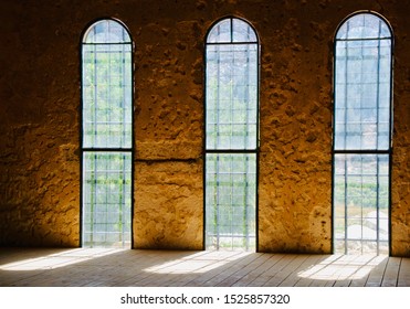 Sunlight Streaming Through Three Glorious Windows