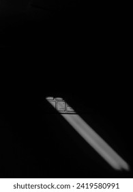 The sunlight streaming through the window forms beautiful shadows