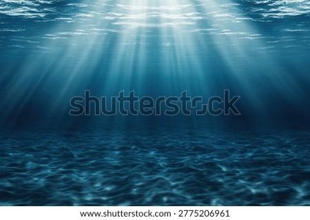 Sunlight streams through the ocean's surface, illuminating the underwater world with a mesmerizing display of light and shadow. The water's surface ripples, creating patterns on the seabed.