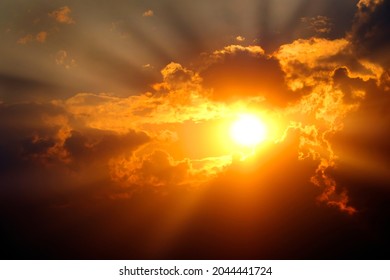 Sunlight sun rays shining through clouds in sky symbolizing hope and redemption