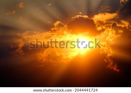 Sunlight sun rays shining through clouds in sky symbolizing hope and redemption