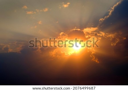 Sunlight sun rays shining through clouds in sky symbolizing hope and redemption