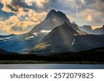 Sunlight through the Clouds on the Mountains over Swiftcurrent Lake, Many Glacier, Glacier National Park, Montana