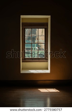 Sunlight through window casting shadow on wooden floor, minimalist interior background