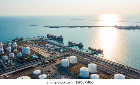 Sunlight At Twilight Of Oil Loading Dock Of Oil Tanker Of Business Logistic Sea Going Ship, Crude Oil Tanker Lpg Ngv At Night / Group Oil Tanker Ship To Port Of Singapore - Cargo Ship Import Export