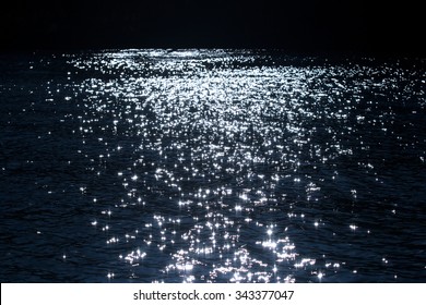 sunlight twinkling and reflecting off lake water