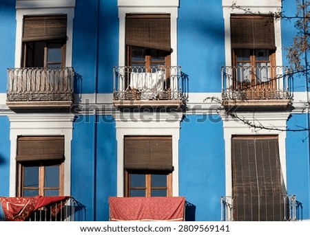 Sunlit intervals shaping a rhythmic façade of color, shadow, and lived texture (Granada, Spain: 3-apr-2026)