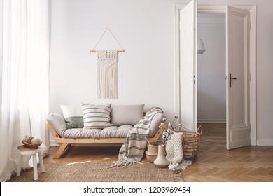 Sunlit Living Room Interior With Open Door, Herringbone Parquet Floor, Natural, Beige Textiles And White Walls